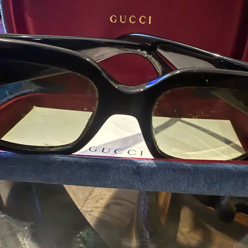 Gucci Black and Gold Sunglasses.    Side small crack shown on photo